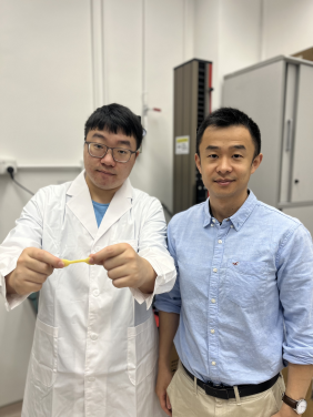 Dr Lizhi Xu (right), with the first author of the article PhD student Mr Mingze Sun holding the tendon-mimetic hydrogel